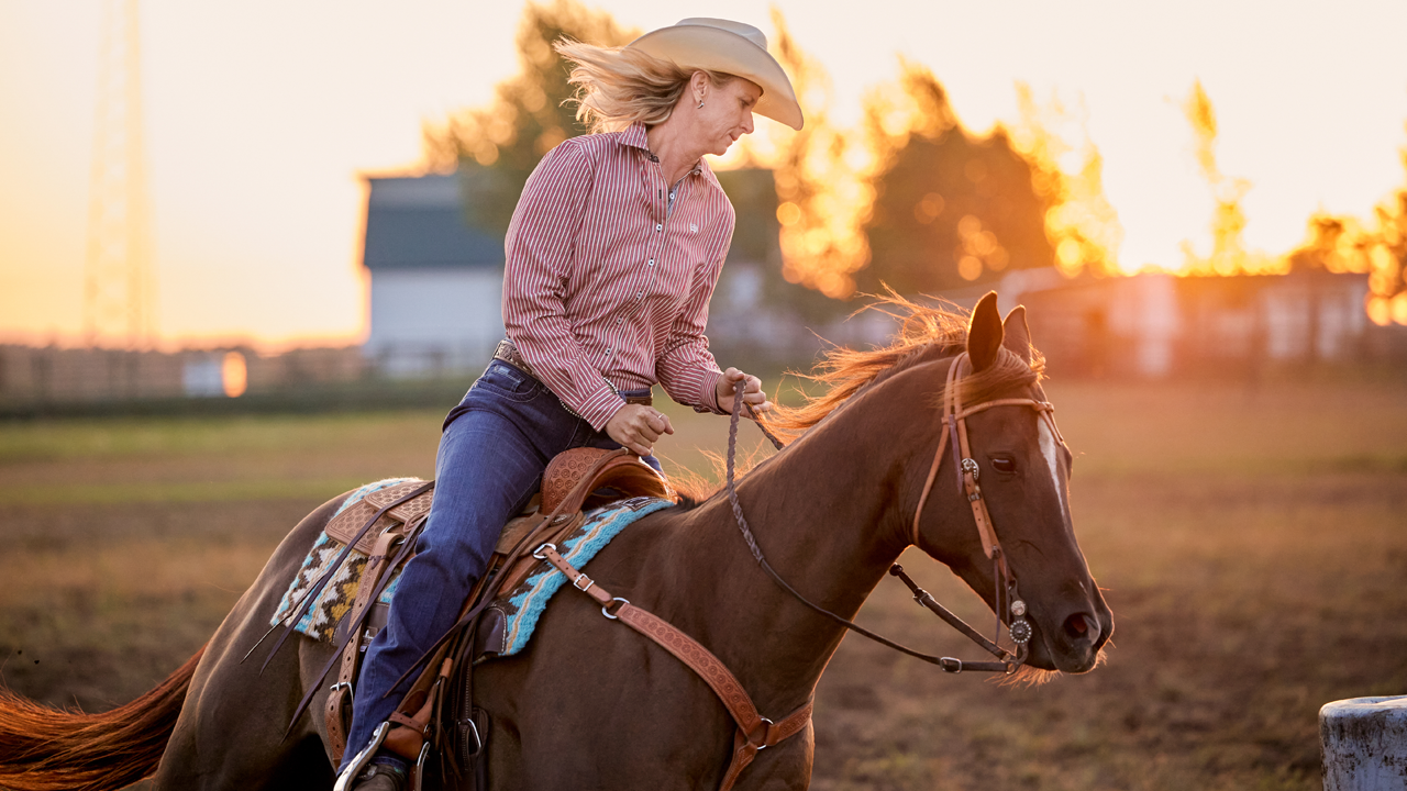 WPRA barrel racer Sherry Cervi practicing barrels on her horse.